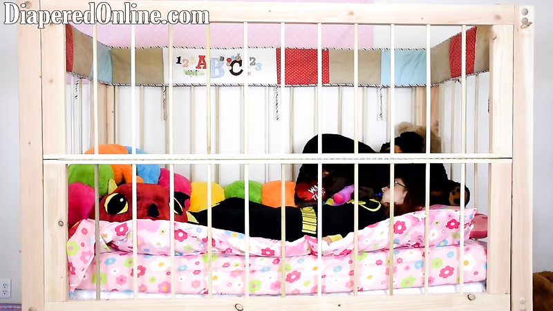 Red: Playing in Crib