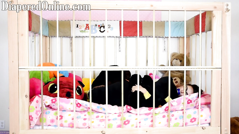 Red: Playing in Crib