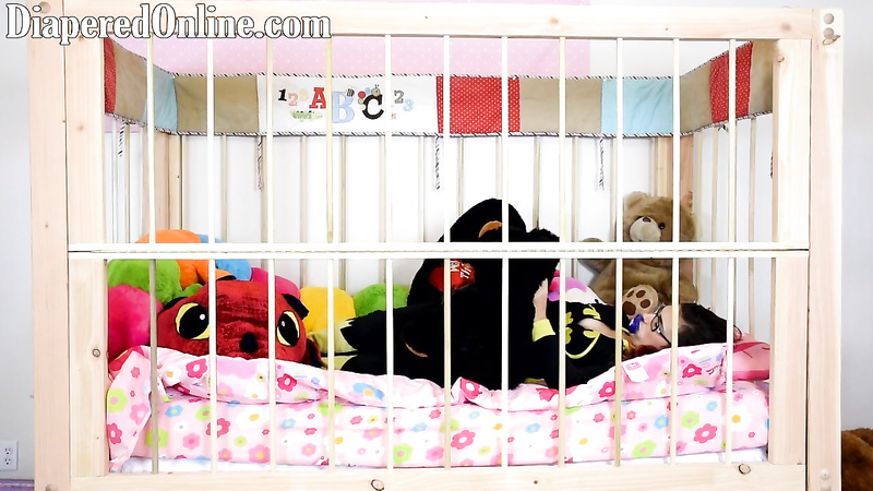 Red: Playing in Crib