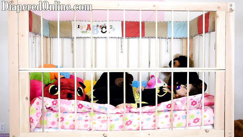 Red: Playing in Crib