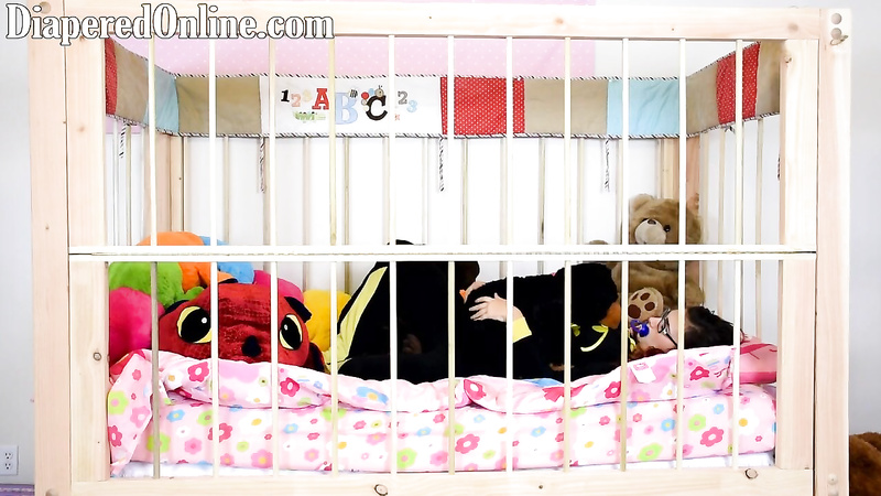 Red: Playing in Crib