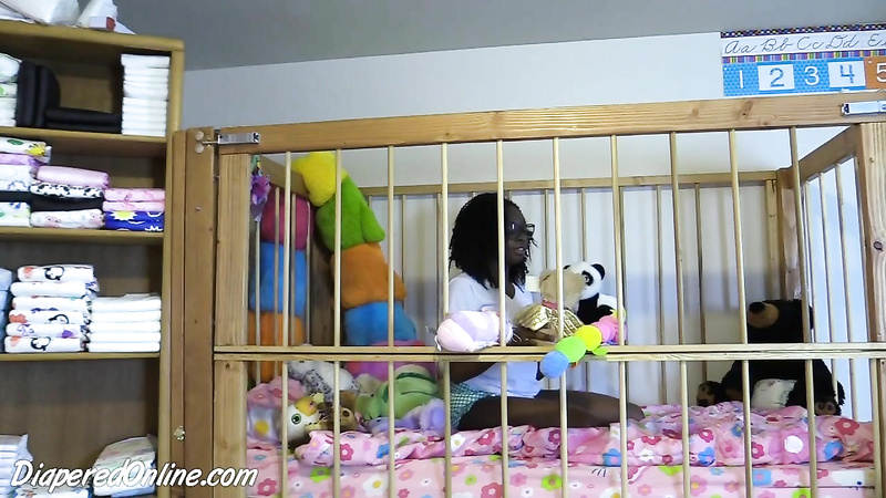 Iris: Playing in Crib
