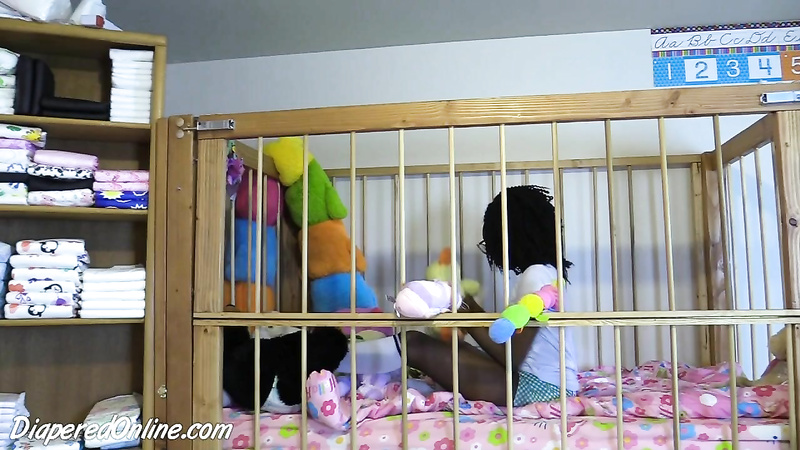 Iris: Playing in Crib
